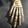 Bejeweled Skeleton Hand Brooch